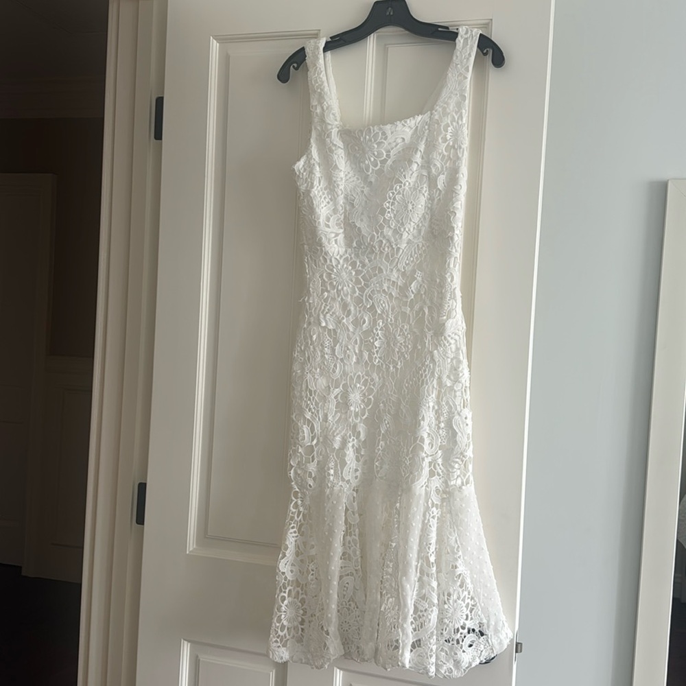 Eyelet looking dress. Lined to ruffle.